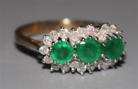 A 9ct gold emerald and diamond triple cluster ring, size O.